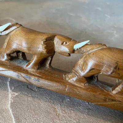 Wood carved March of Elephants