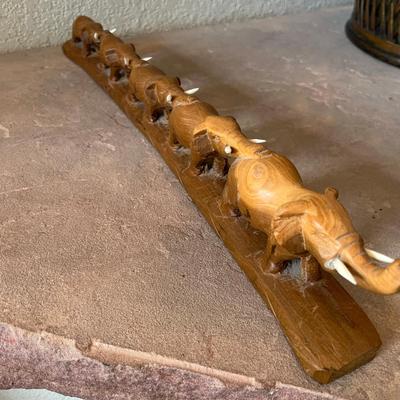 Wood carved March of Elephants