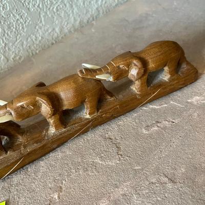 Wood carved March of Elephants