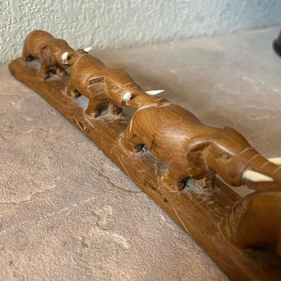 Wood carved March of Elephants