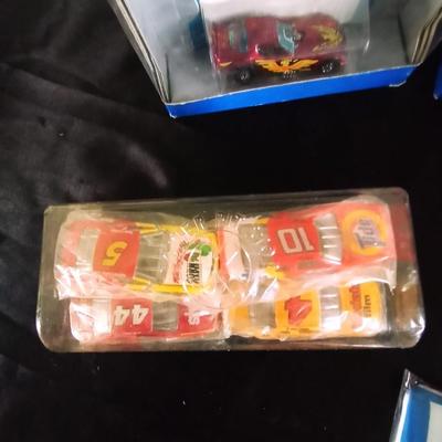 HOT WHEELS AND OTHER RACING CARS- TRACKS AND RACING SHIRT