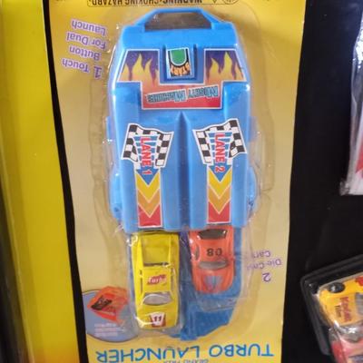 HOT WHEELS AND OTHER RACING CARS- TRACKS AND RACING SHIRT
