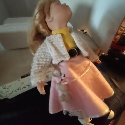 TWO PORCELIAN DOLLS DRESSED IN 50'S ERA