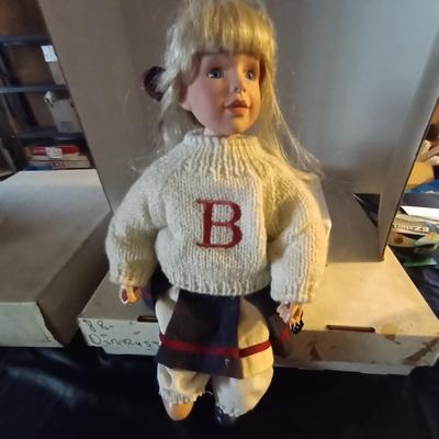 TWO PORCELIAN DOLLS DRESSED IN 50'S ERA