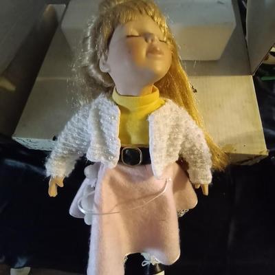 TWO PORCELIAN DOLLS DRESSED IN 50'S ERA