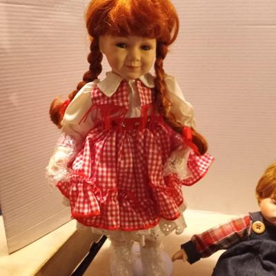 TWO GIRL AND BOY PORCELIAN DOLLS