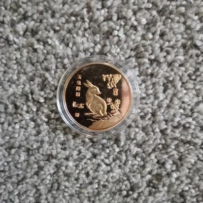 US MINTED QUARTER DOLLAR AND RABBIT COIN