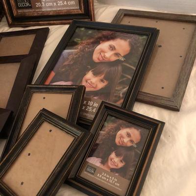 Large basket full of picture frames -Lot 273