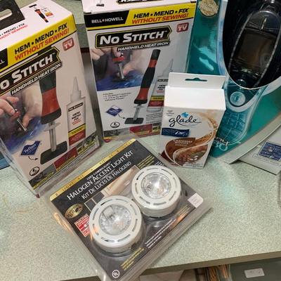 New In Box Household Products Lot Universal Remote Heat Irons Halogen Lites