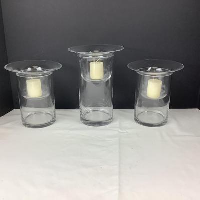 Lot 331  Set of Three Clear Glass Votive Cylinders