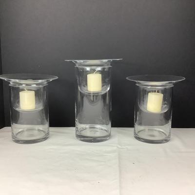 Lot 331  Set of Three Clear Glass Votive Cylinders
