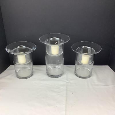 Lot 331  Set of Three Clear Glass Votive Cylinders