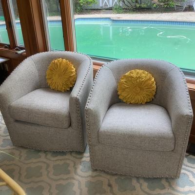 Lot 336. Pair of Nailhead Swivel Barrel Accent Chairs and Decorative Pillows