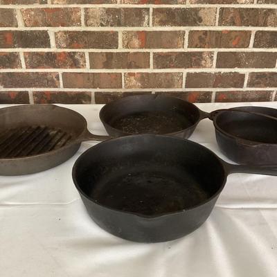 Four Cast Iron Pans