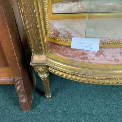 Lot 513 | Gold Curved Front Vitrine