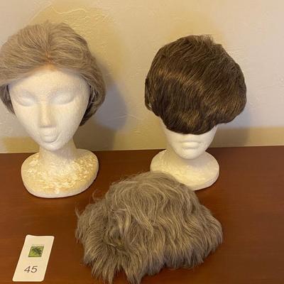 Vintage hairdryer with collection of wigs