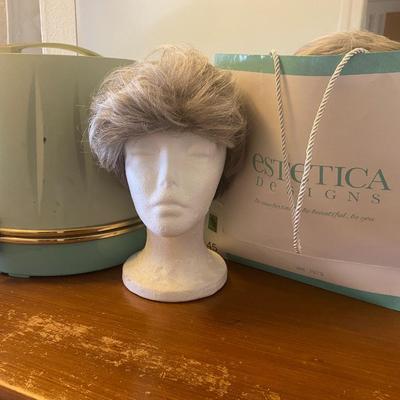 Vintage hairdryer with collection of wigs