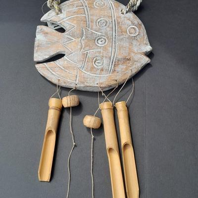 Two Vintage Hawaiian Huggables cloth dolls and an Indonesian Fish wind chime