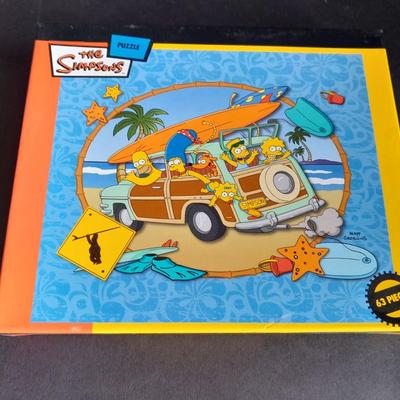The Simpson's T.V. Show Collectable Trivia game and sealed puzzles!