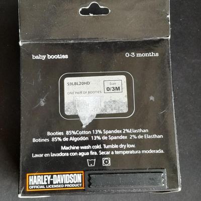 Harley Davidson Baby Booties 0-3 months and a Harley pig on Motorcycle figure