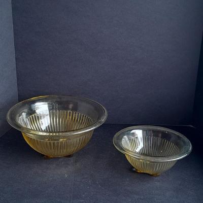 Two nesting Yellow Federal depression glass mixing bowls with wide rims