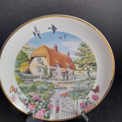 Two Collectible plates with Certificates of Authenticity "Pugnacious Playmate" and "Rose Cottage"