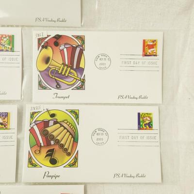 6 - FIRST DAY STAMPS - 2003 HOLIDAY MUSIC MAKERS / PSA VENDING BOOKLET