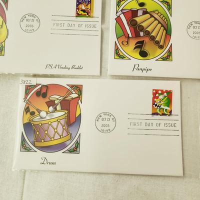 6 - FIRST DAY STAMPS - 2003 HOLIDAY MUSIC MAKERS / PSA VENDING BOOKLET