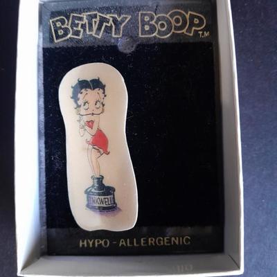 Signed Betty Boop pin and a Betty Boop zip up makeup / pencil bag