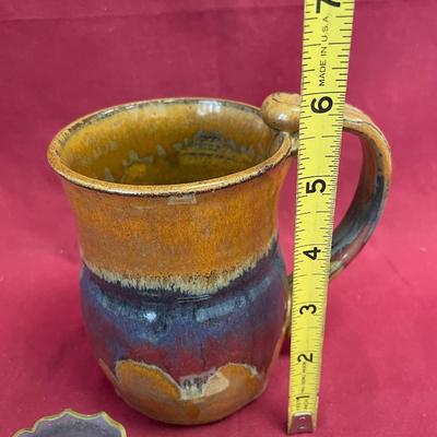 Mug and Avon empty container