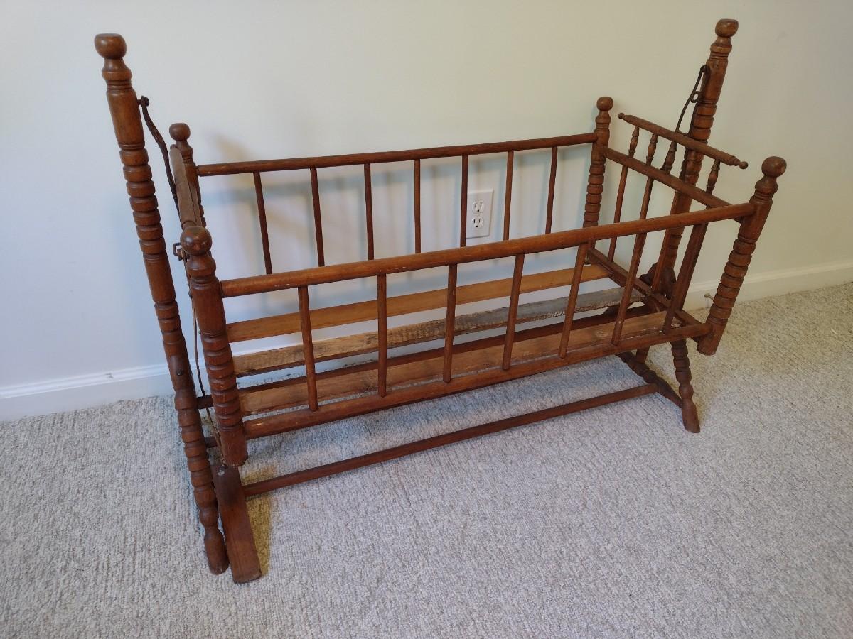 Antique Solid Wood Bassinet with Turned Spindles | EstateSales.org