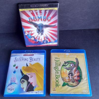 Three Children's movies on DVD Blue Ray Dumbo, Sleeping Beauty, and The Jungle Book