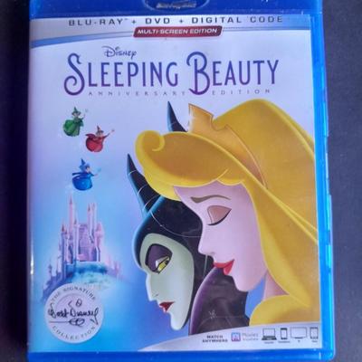 Three Children's movies on DVD Blue Ray Dumbo, Sleeping Beauty, and The Jungle Book