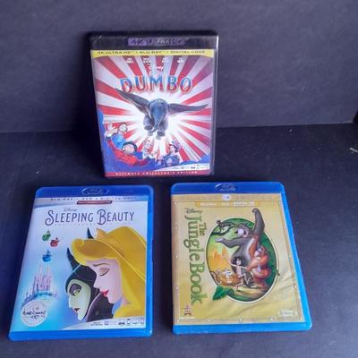 Three Children's movies on DVD Blue Ray Dumbo, Sleeping Beauty, and The Jungle Book