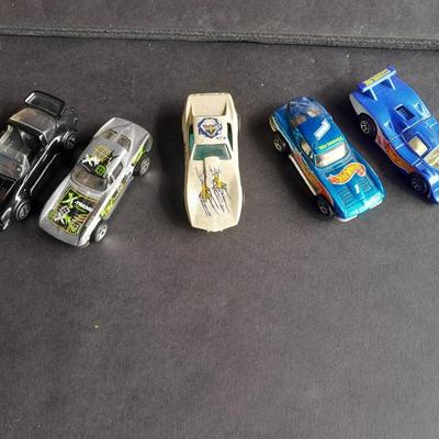 4 Hot Wheel cars and 1 Corgi Brand car