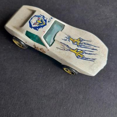 4 Hot Wheel cars and 1 Corgi Brand car