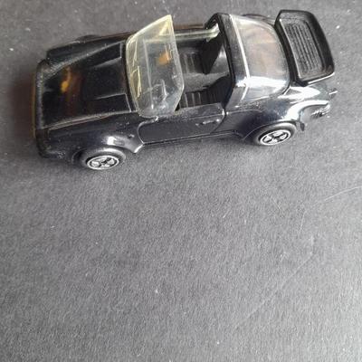 4 Hot Wheel cars and 1 Corgi Brand car