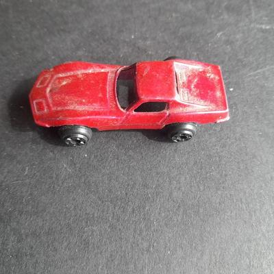 5 Hot Wheel cars and one little metal red car