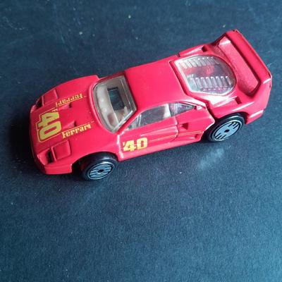 5 Hot Wheel cars and one little metal red car
