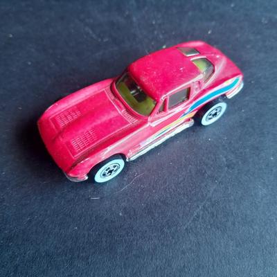 5 Hot Wheel cars and one little metal red car