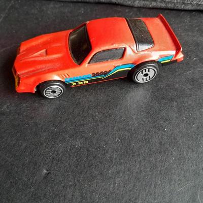 5 Hot Wheel cars and one little metal red car