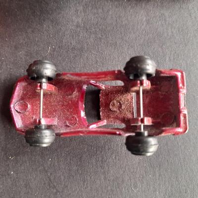 5 Hot Wheel cars and one little metal red car