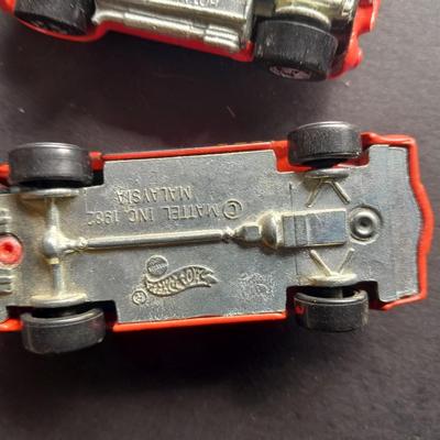 5 Hot Wheel cars and one little metal red car