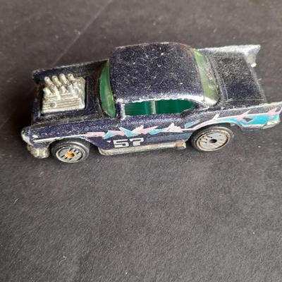 Tomy Tomica car with 4 Hot Wheels