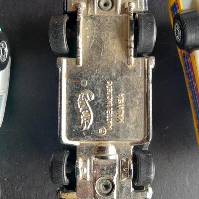 Tomy Tomica car with 4 Hot Wheels