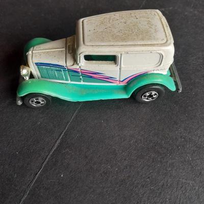 Tomy Tomica car with 4 Hot Wheels