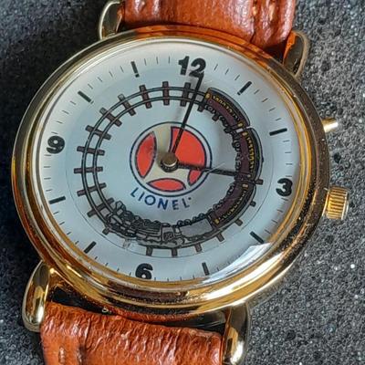 Vintage Lionel Collectible Trains Wristwatch with Brown Leather band has a Moving Train!! complete with Tin