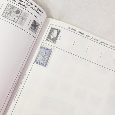 POSTAGE STAMP ALBUM - WITH STAMPS