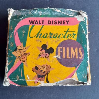 Walt Disney Prod. chalkware Pluto statue and Vintage Walt Disney Character Films reel