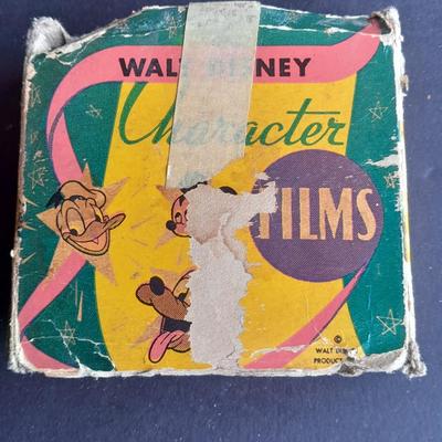 Walt Disney Prod. chalkware Pluto statue and Vintage Walt Disney Character Films reel